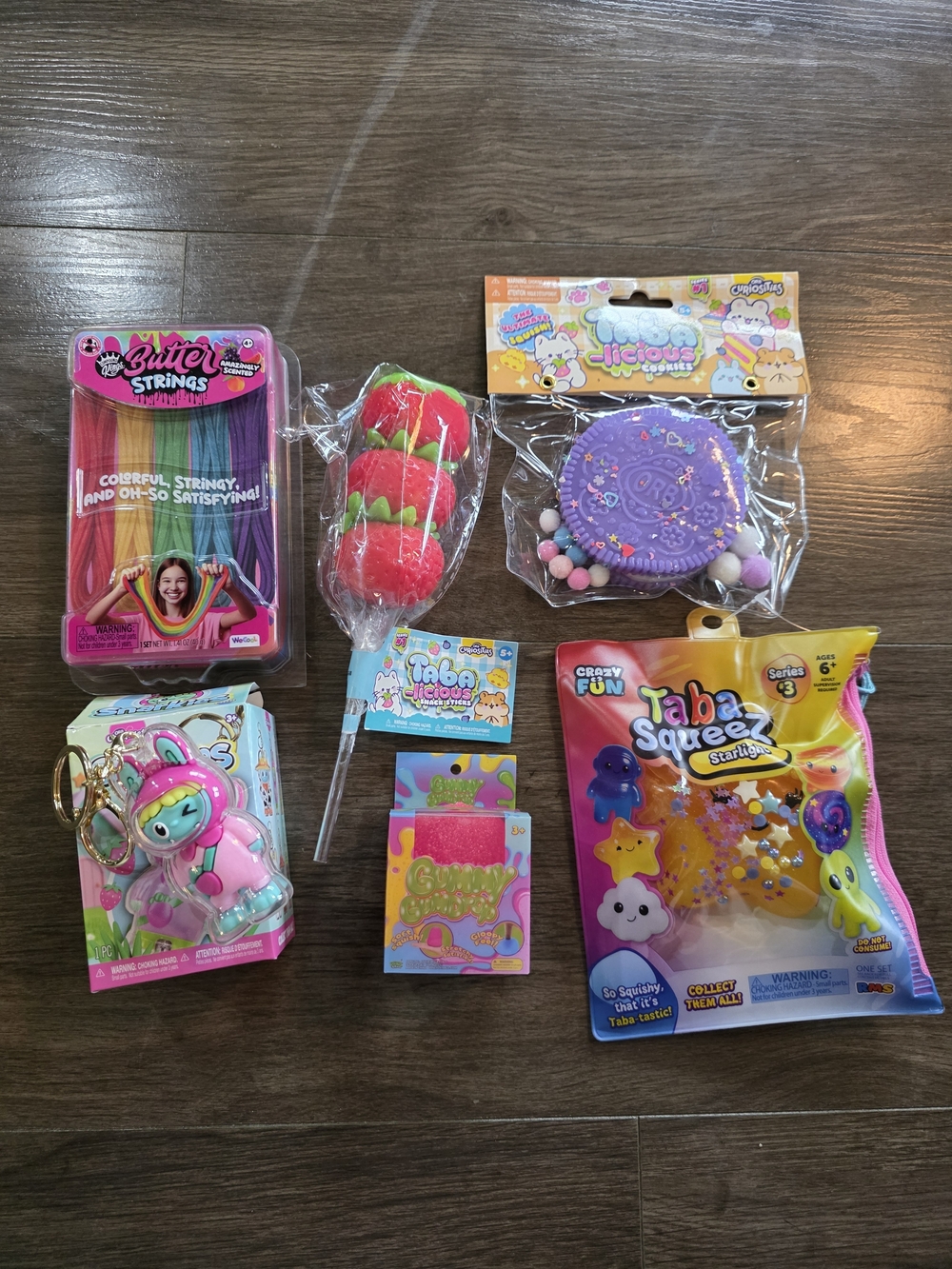 Lot of 6 toys. 3 Taba squishies, 1 pink gumdrop, 1 butter strings, 1 snarkie